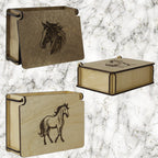 Three wooden boxes with horse engravings on a marble background