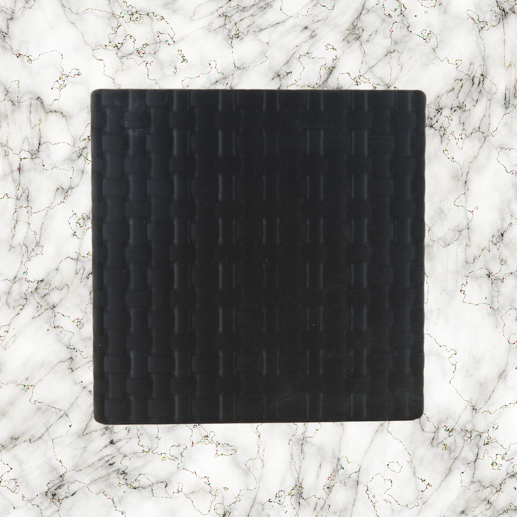 Black weave textured lightbox lid on a marble background