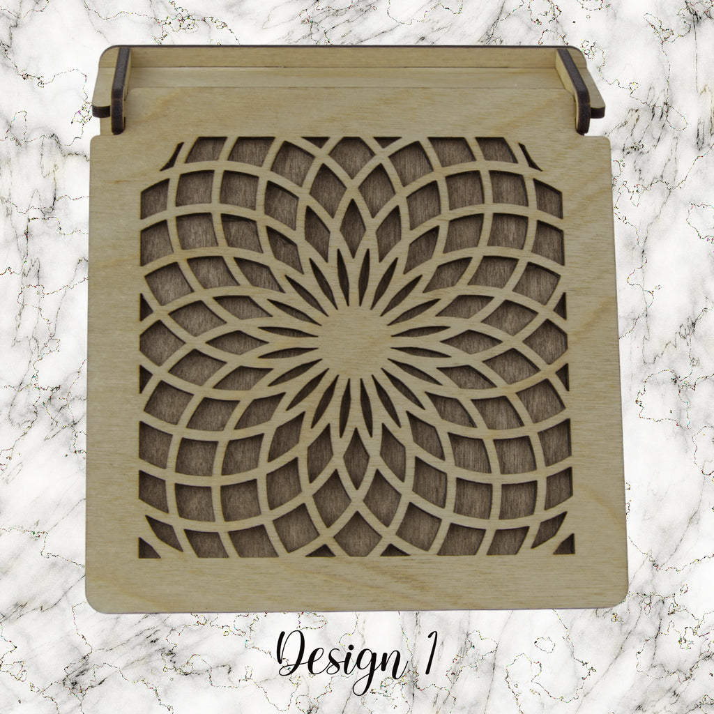 Decorative trinket box with pattered lid on a marble background