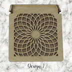 Decorative trinket box with pattered lid on a marble background