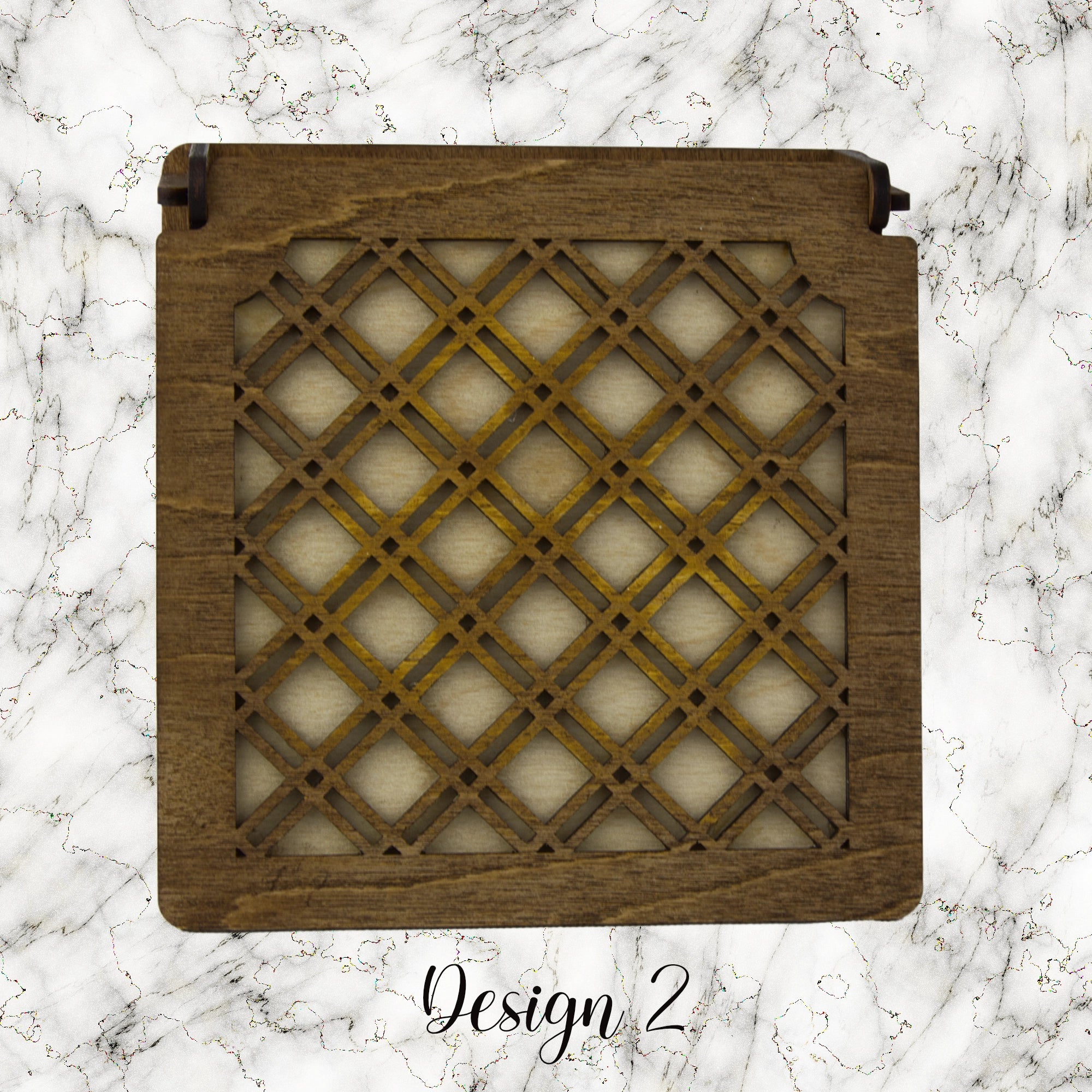 Decorative trinket box with pattered lid on a marble background